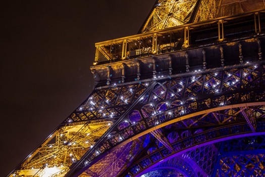 Photo of sparkles on a pillar of the Eiffel Tower